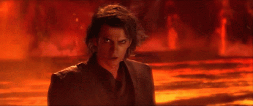 A Man Is Standing In Front Of A Fire And Says " You Underestimate My Power " GIF