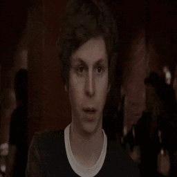 A Man Is Standing In Front Of A Fire With The Words I Gotta Written On The Bottom GIF