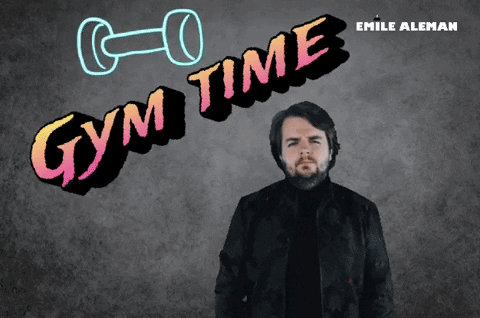 A Man Is Standing In Front Of A Gym Time Sign GIF