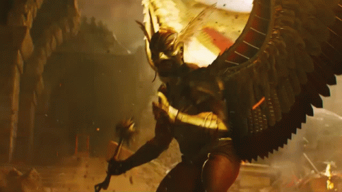 A Man Is Standing In Front Of A Large Monster GIF