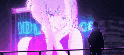 A Man Is Standing In Front Of A Large Neon Sign That Says Idol GIF