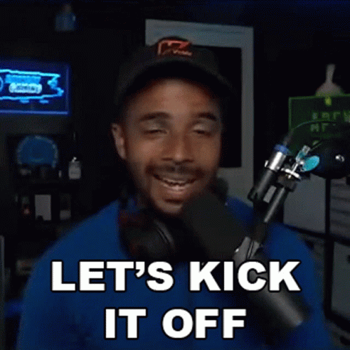 A Man Is Standing In Front Of A Microphone With His Eyes Closed And Says Let 'S Kick It Off . GIF