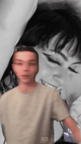 A Man Is Standing In Front Of A Painting Of A Woman GIF