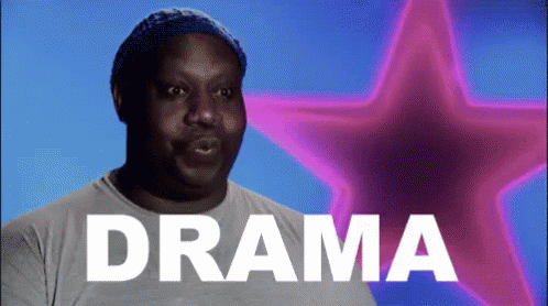 A Man Is Standing In Front Of A Purple Star And The Word Drama Is On The Screen GIF