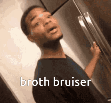 A Man Is Standing In Front Of A Refrigerator With The Words Broth Bruiser Written On The Bottom GIF