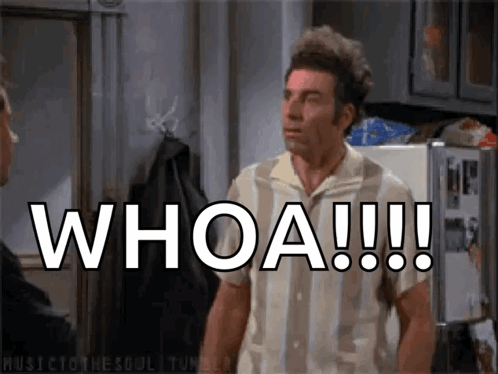 A Man Is Standing In Front Of A Refrigerator With The Words Whoa Written On It GIF