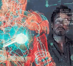 A Man Is Standing In Front Of A Screen That Says Soe On It GIF