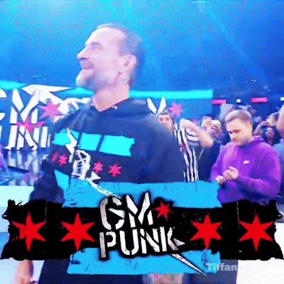 A Man Is Standing In Front Of A Sign That Says Cm Punk GIF