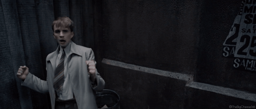 A Man Is Standing In Front Of A Sign That Says I Can Do This All Day GIF