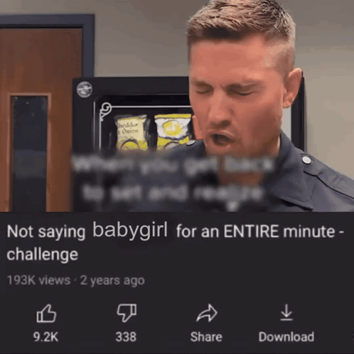 A Man Is Standing In Front Of A Sign That Says Not Saying Babygirl For An Entire Minute Challenge GIF