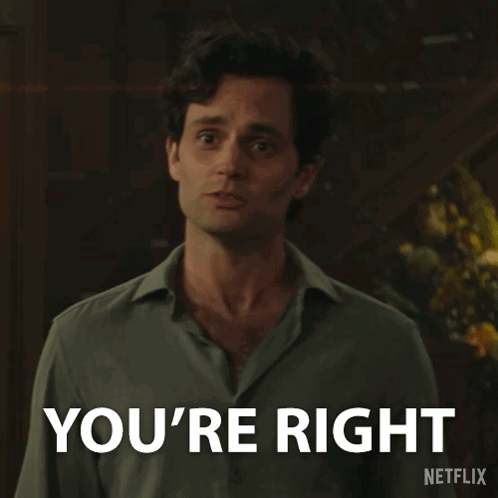 A Man Is Standing In Front Of A Sign That Says You 'Re Right GIF