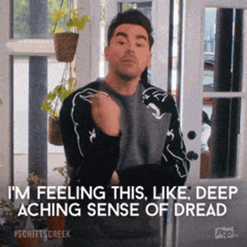 A Man Is Standing In Front Of A Sliding Glass Door And Says I 'M Feeling This Like Deep Aching Sense Of Dread GIF
