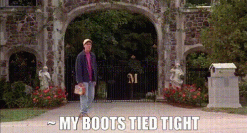 A Man Is Standing In Front Of A Stone Archway With The Words `` My Boots Tied Tight '' Written On The Bottom . GIF
