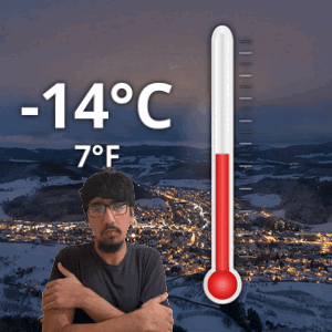 A Man Is Standing In Front Of A Thermometer That Reads -14 Degrees Celsius GIF