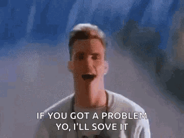 A Man Is Standing In Front Of A Wall And Saying `` If You Got A Problem Yo I 'Ll Solve It '' . GIF