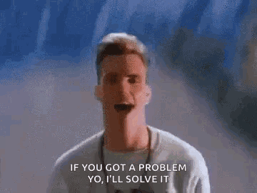 A Man Is Standing In Front Of A Wall And Talking About A Problem . GIF