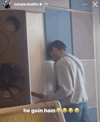 A Man Is Standing In Front Of A Wall With The Caption He Goin Ham GIF