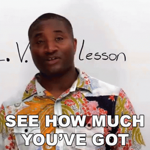 A Man Is Standing In Front Of A White Board With The Word Lesson Written On It GIF