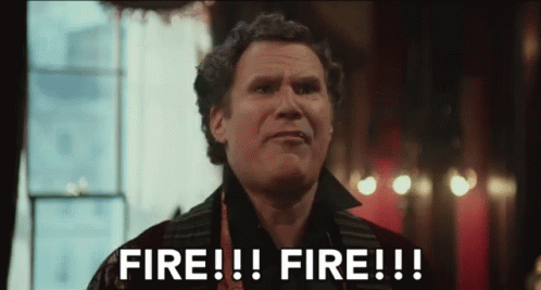 A Man Is Standing In Front Of A Window And Saying Fire !!! Fire !!! . GIF
