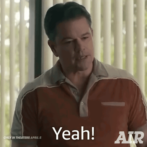 A Man Is Standing In Front Of A Window And Says " Yeah " GIF