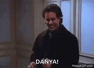 A Man Is Standing In Front Of A Window Holding A Ring And Says `` Dany ! '' GIF
