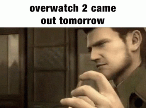 A Man Is Standing In Front Of A Window With His Hand On His Chin And A Meme That Says Overwatch 2 Came Out Tomorrow . GIF