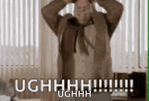 A Man Is Standing In Front Of A Window With His Hands On His Head And Says Ughhhh . GIF