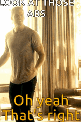 A Man Is Standing In Front Of A Window With The Caption " Look At Those Abs " GIF