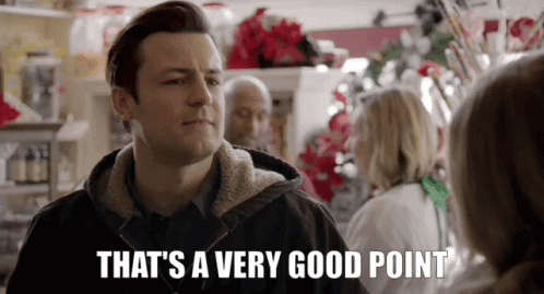 A Man Is Standing In Front Of A Woman In A Store And Says `` That 'S A Very Good Point '' . GIF