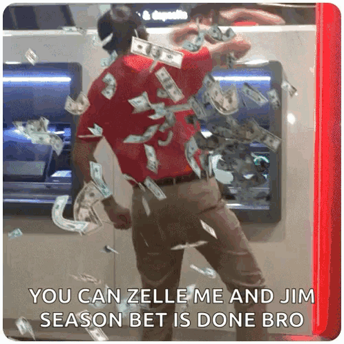 A Man Is Standing In Front Of An Atm Machine With Money Falling From It GIF