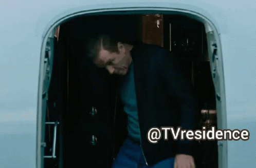 A Man Is Standing In The Doorway Of An Airplane With The Words @Tvresidence Written Below Him GIF