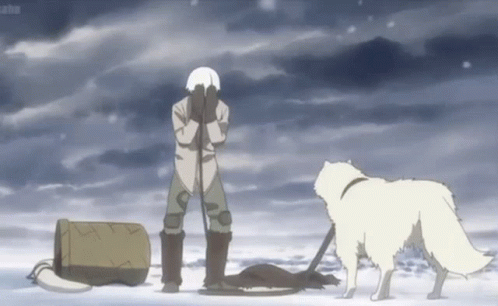 A Man Is Standing In The Snow With His Hands On His Face And A Dog Standing Next To Him . GIF