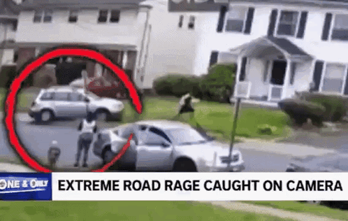 A Man Is Standing Next To A Car In Front Of A House In A Video That Was Caught On A Camera . GIF