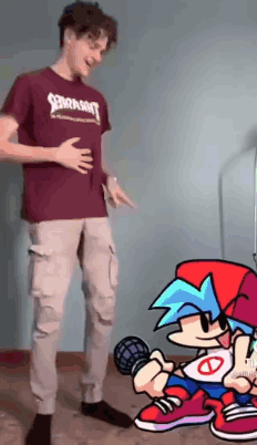 A Man Is Standing Next To A Cartoon Character And Holding His Belly . GIF