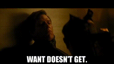 A Man Is Standing Next To A Cat In A Dark Room And Says `` Want Does N't Get . '' GIF