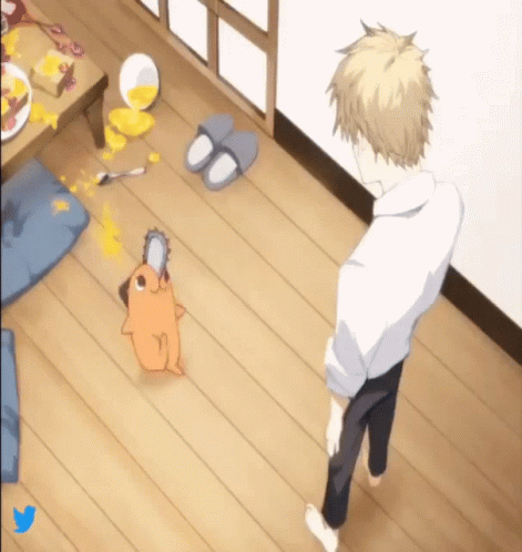 A Man Is Standing Next To A Chainsaw Dog On The Floor GIF