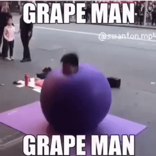 A Man Is Standing Next To A Purple Ball On A Yoga Mat On The Side Of The Road . GIF