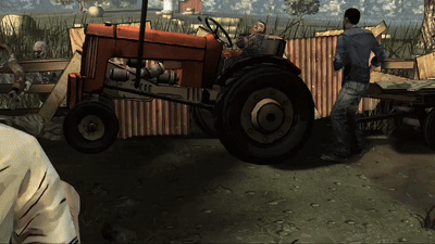 a man is standing next to a red tractor