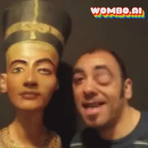 A Man Is Standing Next To A Statue Of A Woman With Wombo.ai Written In The Corner GIF