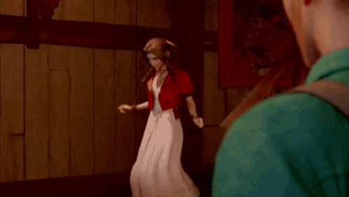 A Man Is Standing Next To A Woman In A Red Dress In Front Of A Mirror . GIF