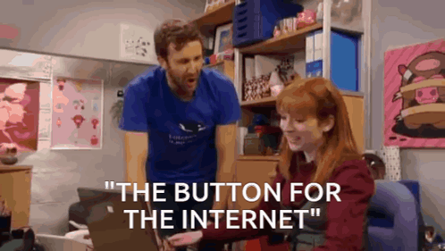 A Man Is Standing Next To A Woman Who Is Using A Laptop And Says " The Button For The Internet " GIF