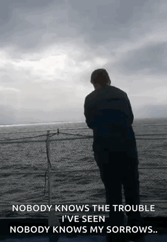 A Man Is Standing On A Balcony Overlooking The Ocean With A Quote That Says Nobody Knows The Trouble GIF