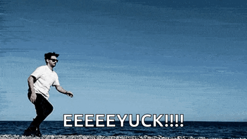 A Man Is Standing On A Beach With The Words Eeeeyuck !!! Behind Him GIF