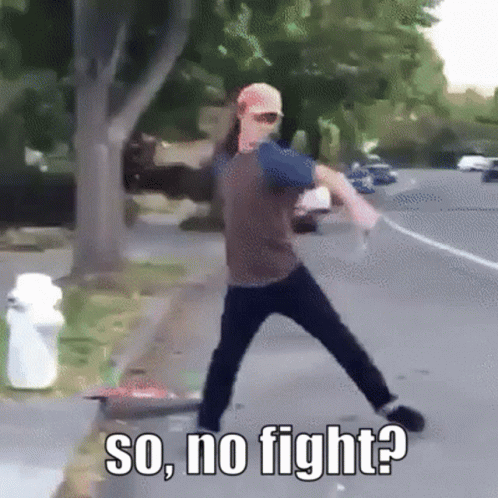 A Man Is Standing On A Sidewalk With The Words So No Fight GIF