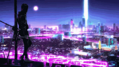 A Man Is Standing On Top Of A Building Looking At A City At Night GIF