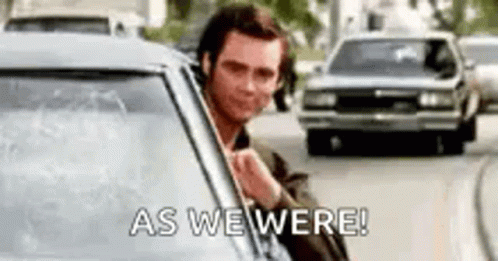A Man Is Sticking His Head Out Of A Car Window And Saying `` As We Were '' . GIF