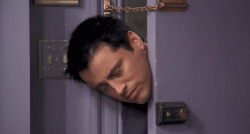 A Man Is Sticking His Head Out Of A Door With The Words I 'M Stuck Below Him . GIF