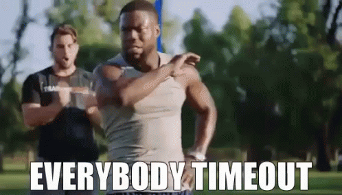 A Man Is Stretching His Arms In A Park With The Words `` Everybody Timeout '' . GIF