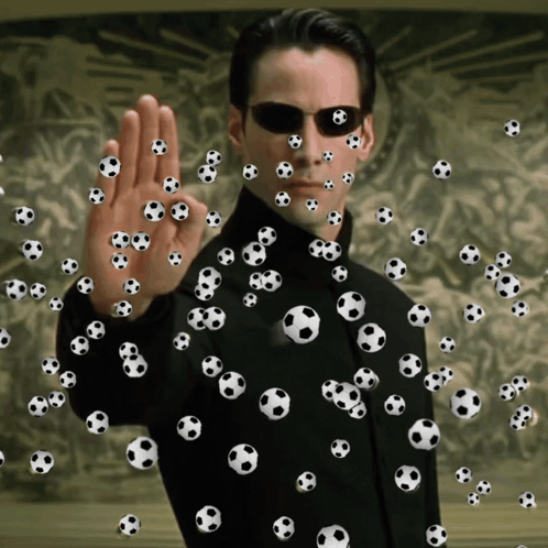 A Man Is Surrounded By Soccer Balls And Making An Ok Sign GIF