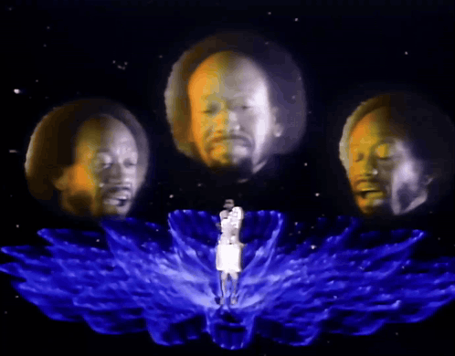 a man is surrounded by three heads that are projected on to him
